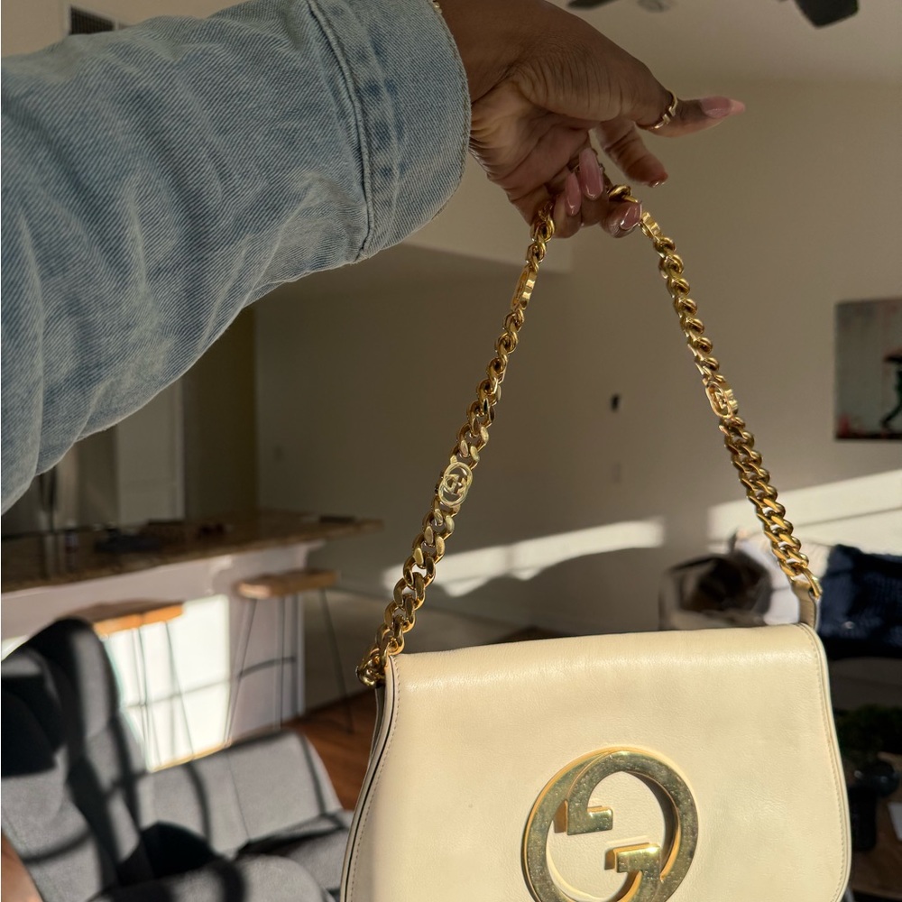 Gucci blondie clutch with extra cross body strap.